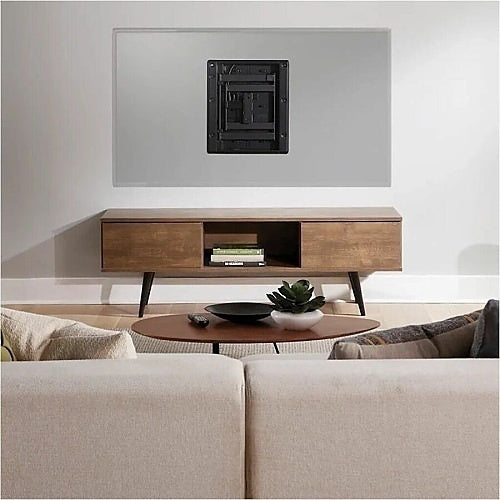 Sanus VIWLF128-B2 In-Wall Full Motion TV Wall Mount 42–85 Inch
Modern living room with a wooden TV stand, beige sofa, and wall-mounted television.