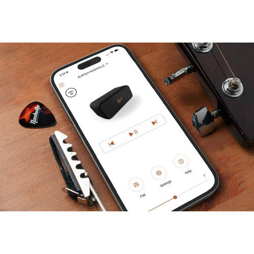 Klipsch Nashville 18W Portable Bluetooth Speaker Waterproof 360 Audio
Phone displaying a guitar app on a wooden surface with a guitar pick and effects pedal.