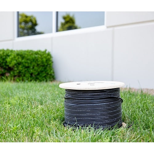Wirepath SP-144-DB-500 14/4 Direct Burial Speaker Wire 500ft Drum
Spool of black cable on grass with a white wall and greenery in the background
