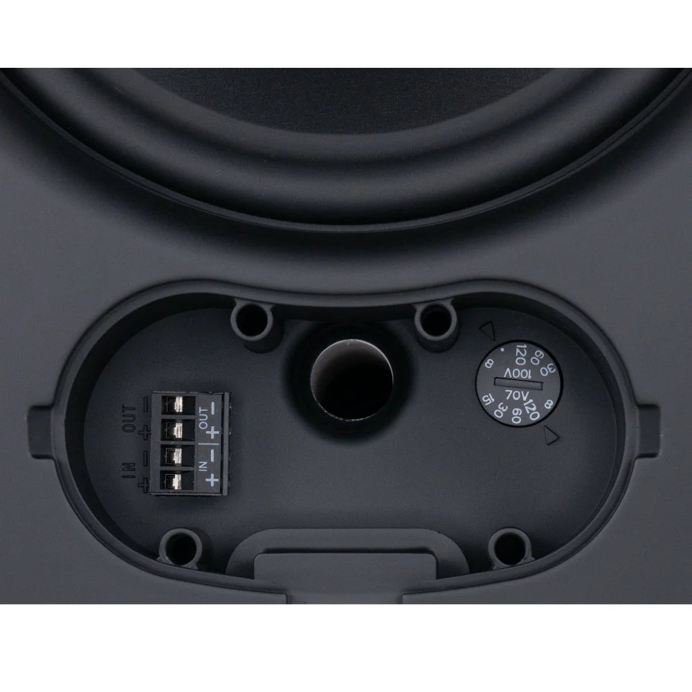 Close-up of audio equipment with control knobs and connectors on a black background