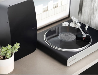 Victrola Carbon VPT-3000 Turntable Ortofon Wireless Sonos-Ready
Turntable on a table with a plant and window in the background