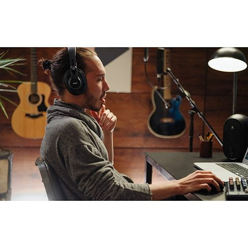 AKG K371-BT Bluetooth Closed-Back Studio Headphones Built-in Mic men wearing in a studio