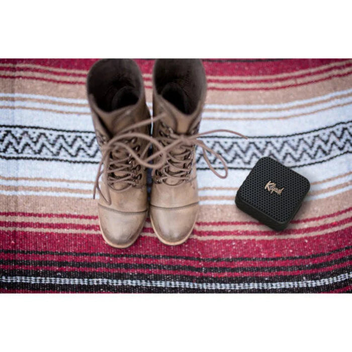 Klipsch Austin 18W Portable Bluetooth Speaker Waterproof Microphone next to  boots