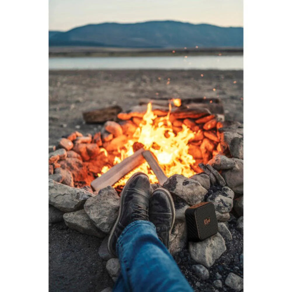 Klipsch Austin 18W Portable Bluetooth Speaker Waterproof Microphone
Person sitting by a campfire with mountains in the background