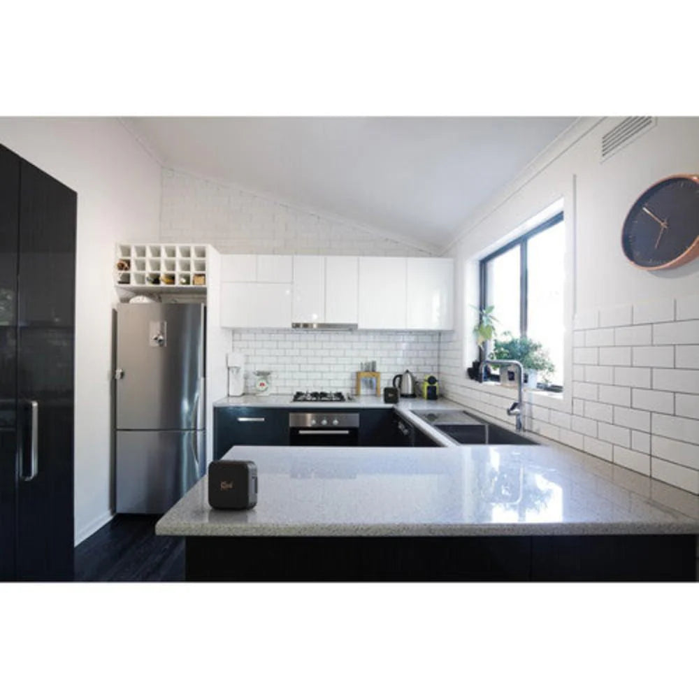 Klipsch Austin 18W Portable Bluetooth Speaker Waterproof Microphone
Modern kitchen with white cabinets, stainless steel appliances, and a clock on the wall.