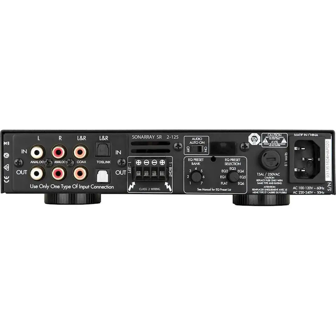 Back panel of an audio equipment with various connectors and labels on a white background