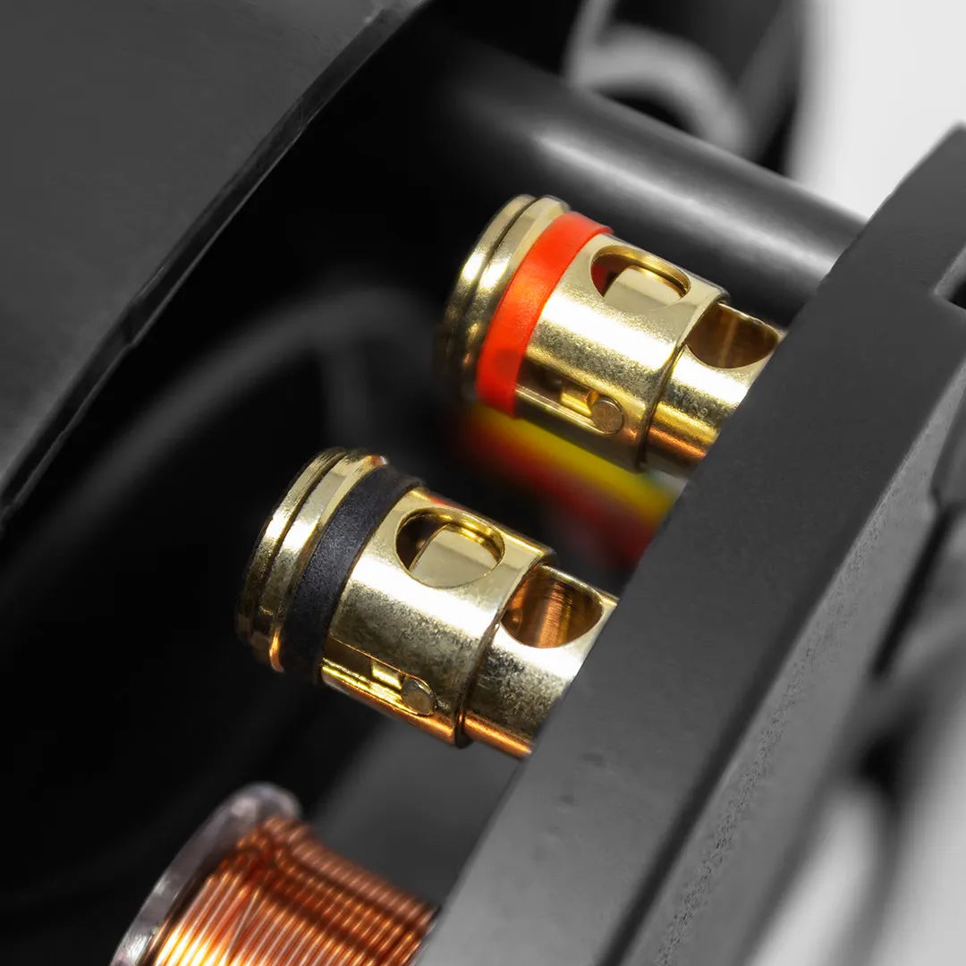 Elura S6.5ST 6.5 Inch Stereo In-Ceiling Dual Speaker by Sonance
Close-up of gold connectors with black and red accents on a mechanical background