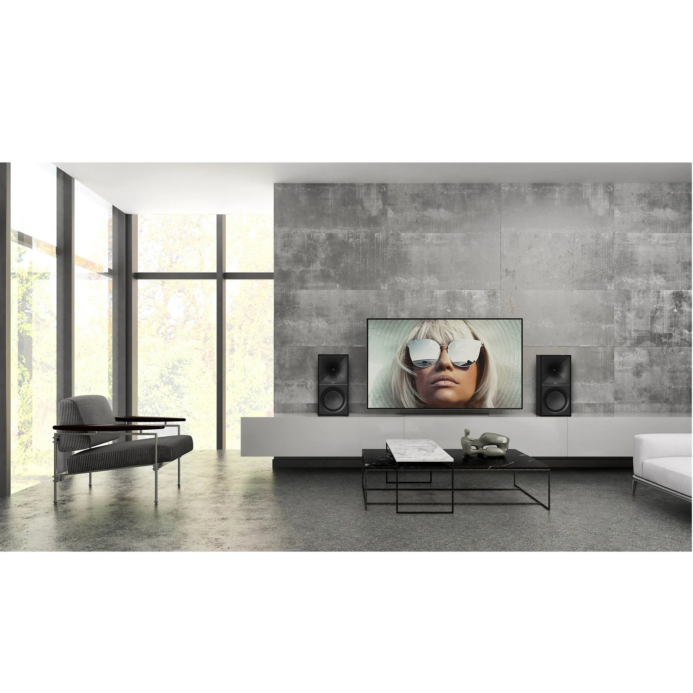 Klipsch The Nines Wireless Powered Speakers 480W Bluetooth Pair
Modern living room with a large TV displaying an image of a person wearing sunglasses, flanked by two speakers.